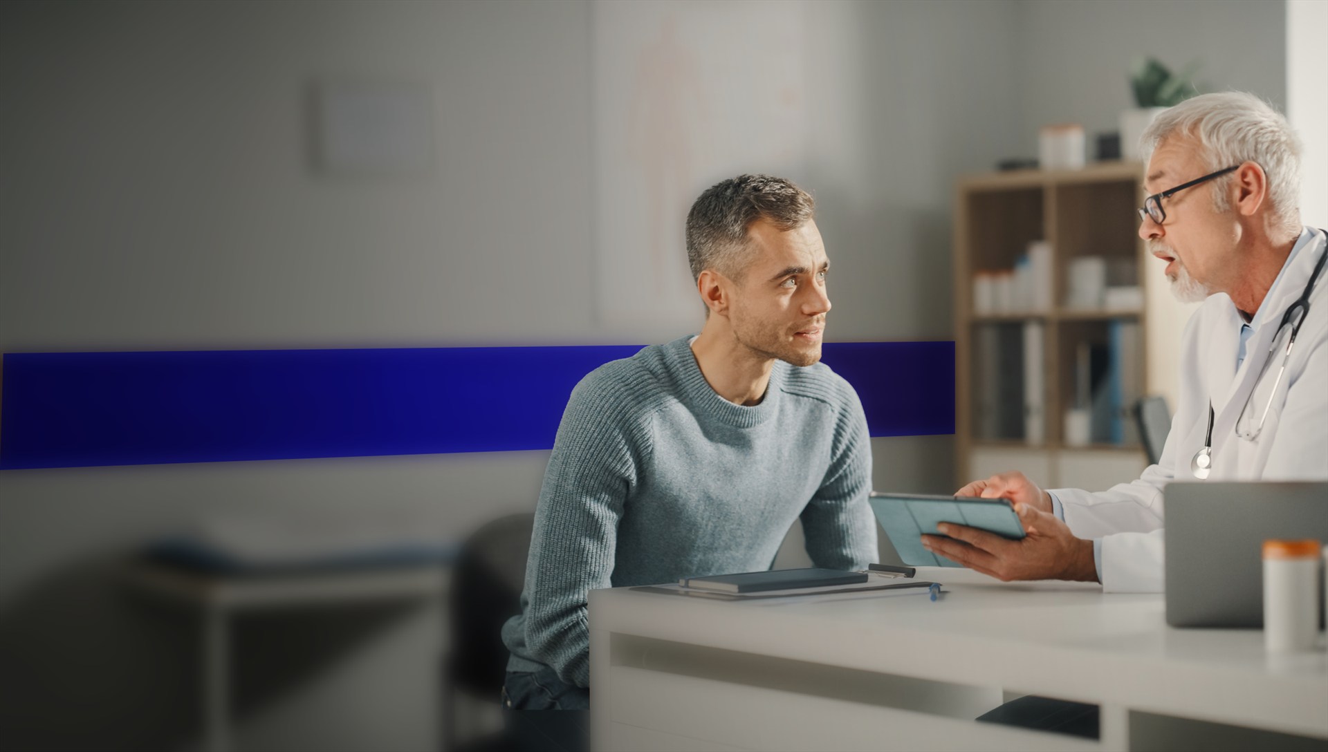 A physician and patient discussing care together.